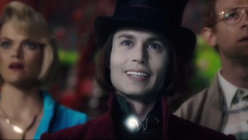 Movie still from “Charlie and the Chocolate Factory” (2005), directed by Tim Burton – A man wearing a top hat with a light on it; Close Up shot, Over the shoulder angle