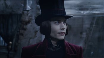 Movie still from “Charlie and the Chocolate Factory” (2005), directed by Tim Burton – A man wearing a top hat and a red jacket; Close Up shot, Over the shoulder angle