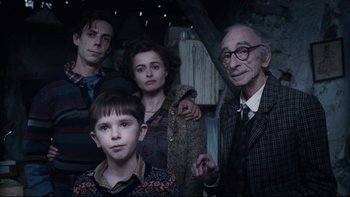 Movie still from “Charlie and the Chocolate Factory” (2005), directed by Tim Burton – A group of people standing next to each other in a room; Medium shot, Low angle