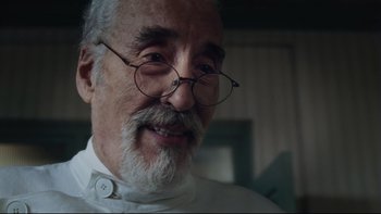 Movie still from “Charlie and the Chocolate Factory” (2005), directed by Tim Burton – An older man with a beard and glasses; Close Up shot, Low angle