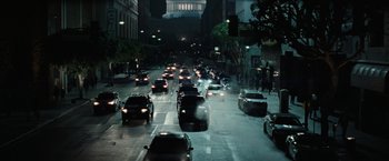 Movie still from “Suicide Squad” (2016), directed by David Ayer – A city street filled with lots of traffic at night; Extreme Wide shot, High angle