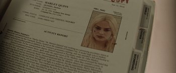 Movie still from “Suicide Squad” (2016), directed by David Ayer – A person's face on a police report; Extreme Close Up shot, High angle