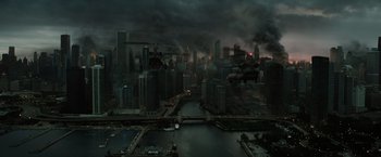 Movie still from “Suicide Squad” (2016), directed by David Ayer – An aerial view of a large city with dark skies; Extreme Wide shot, High angle