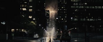 Movie still from “Suicide Squad” (2016), directed by David Ayer – A city street at night filled with lots of traffic; Extreme Wide shot, High angle