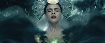 Movie still from “Suicide Squad” (2016), directed by David Ayer – A woman with her eyes closed and her hair in the air; Close Up shot, Overhead angle