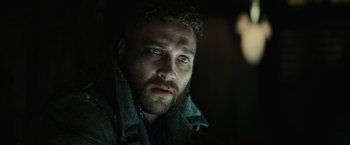 Movie still from “Suicide Squad” (2016), directed by David Ayer – A person with a beard; Close Up shot, Low angle