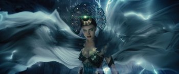 Movie still from “Suicide Squad” (2016), directed by David Ayer – An image of a beautiful woman with an umbrella; Medium shot, Low angle