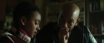 Movie still from “Suicide Squad” (2016), directed by David Ayer – A man and a child looking at each other; Close Up shot, Over the shoulder angle