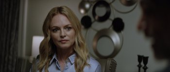 Movie still from “Suitable Flesh” (2023), directed by Joe Lynch – A woman with blonde hair sitting in front of a mirror; Close Up shot, Over the shoulder angle