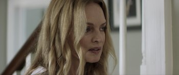 Movie still from “Suitable Flesh” (2023), directed by Joe Lynch – A person with blonde hair; Close Up shot, Over the shoulder angle