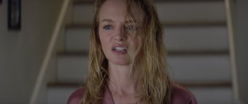 Movie still from “Suitable Flesh” (2023), directed by Joe Lynch – A person with long blonde hair; Close Up shot, Low angle