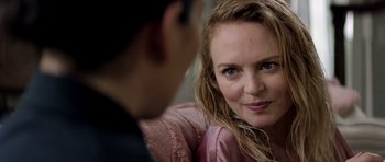 Movie still from “Suitable Flesh” (2023), directed by Joe Lynch – A person sitting in front of another person; Close Up shot, Over the shoulder angle