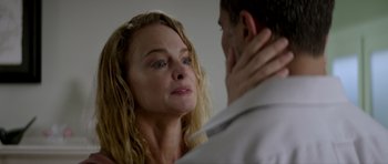 Movie still from “Suitable Flesh” (2023), directed by Joe Lynch – A man and a woman looking at one another; Close Up shot, Over the shoulder angle