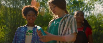 Movie still from “Summering” (2022), directed by James Ponsoldt – Two young girls standing next to each other; Medium shot, Low angle