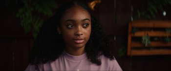 Movie still from “Summering” (2022), directed by James Ponsoldt – A person wearing a pink shirt; Close Up shot, Over the shoulder angle