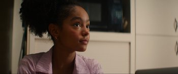 Movie still from “Summering” (2022), directed by James Ponsoldt – A young girl is sitting in front of a television; Close Up shot, Over the shoulder angle