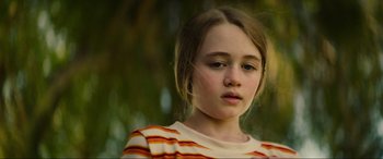Movie still from “Summering” (2022), directed by James Ponsoldt – A young girl is looking into the distance; Close Up shot, Low angle