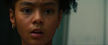 Movie still from “Summering” (2022), directed by James Ponsoldt – A young girl's face with a piercing; Close Up shot, Low angle