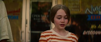 Movie still from “Summering” (2022), directed by James Ponsoldt – A young girl is looking down at her face; Close Up shot, Over the shoulder angle