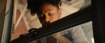 Movie still from “Summering” (2022), directed by James Ponsoldt – A young girl leaning against a window sill; Close Up shot, Low angle