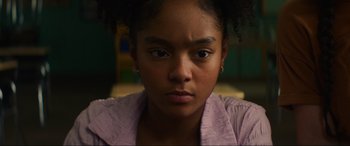 Movie still from “Summering” (2022), directed by James Ponsoldt – A person wearing a purple shirt; Close Up shot, Low angle