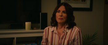 Movie still from “Summering” (2022), directed by James Ponsoldt – A person wearing a striped shirt; Close Up shot, Over the shoulder angle