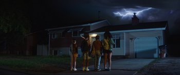 Movie still from “Summering” (2022), directed by James Ponsoldt – A group of people standing in front of a house; Wide shot, Low angle
