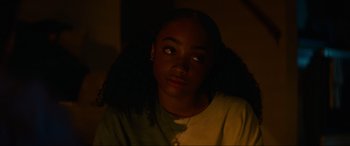 Movie still from “Summering” (2022), directed by James Ponsoldt – A young girl is looking into the camera; Close Up shot, Over the shoulder angle