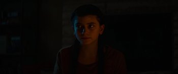 Movie still from “Summering” (2022), directed by James Ponsoldt – A young person is in a dark room; Close Up shot, Over the shoulder angle