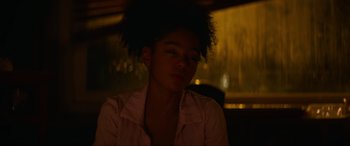 Movie still from “Summering” (2022), directed by James Ponsoldt – A young woman sitting in front of a window; Close Up shot, Over the shoulder angle