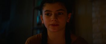 Movie still from “Summering” (2022), directed by James Ponsoldt – A young girl is looking into the camera; Close Up shot, High angle