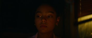 Movie still from “Summering” (2022), directed by James Ponsoldt – A young girl is looking into the camera; Close Up shot, Low angle