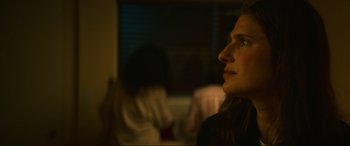 Movie still from “Summering” (2022), directed by James Ponsoldt – A person looking up at something; Close Up shot, Over the shoulder angle