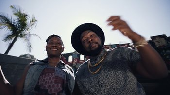 Movie still from “Summertime” (2020), directed by Carlos López Estrada – A couple of men standing next to each other; Close Up shot, Low angle