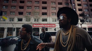Movie still from “Summertime” (2020), directed by Carlos López Estrada – A group of men walking down a street; Medium shot, Low angle