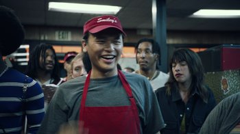 Movie still from “Summertime” (2020), directed by Carlos López Estrada – A group of people standing in a room; Medium shot, Low angle