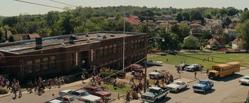 Movie still from “Super 8” (2011), directed by J.J. Abrams – An aerial view of an intersection in a city; Extreme Wide shot, High angle