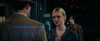 Movie still from “Super 8” (2011), directed by J.J. Abrams – A young blonde woman is looking at a man; Close Up shot, Over the shoulder angle