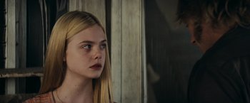 Movie still from “Super 8” (2011), directed by J.J. Abrams – A young blonde haired girl looking into the distance; Close Up shot, Over the shoulder angle