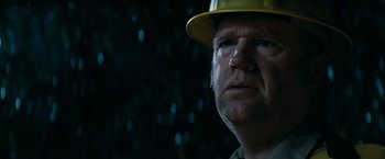 Movie still from “Super 8” (2011), directed by J.J. Abrams – A person wearing a hard hat; Close Up shot, Low angle