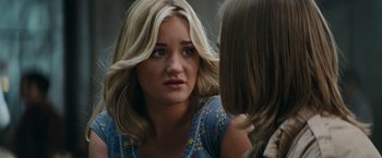 Movie still from “Super 8” (2011), directed by J.J. Abrams – A young woman looking at a young girl in the mirror; Close Up shot, Over the shoulder angle