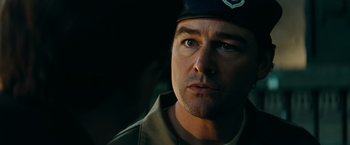 Movie still from “Super 8” (2011), directed by J.J. Abrams – A person wearing a uniform; Close Up shot, Over the shoulder angle