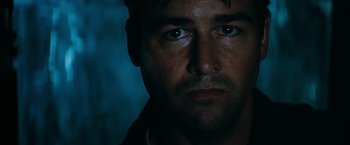Movie still from “Super 8” (2011), directed by J.J. Abrams – A man's face in the dark; Close Up shot, Low angle