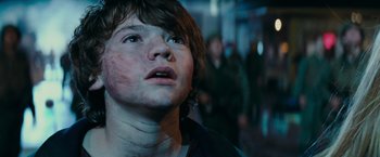 Movie still from “Super 8” (2011), directed by J.J. Abrams – A young boy looking up into the air; Close Up shot, Low angle