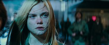 Movie still from “Super 8” (2011), directed by J.J. Abrams – A young girl with long blonde hair and blue eyes; Close Up shot, Low angle