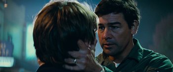 Movie still from “Super 8” (2011), directed by J.J. Abrams – A man is looking at another man's face; Close Up shot, Over the shoulder angle