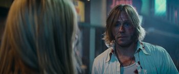 Movie still from “Super 8” (2011), directed by J.J. Abrams – A man and a woman standing next to each other; Close Up shot, Over the shoulder angle