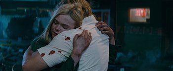 Movie still from “Super 8” (2011), directed by J.J. Abrams – A woman hugging another woman who is covered in blood; Close Up shot, Over the shoulder angle