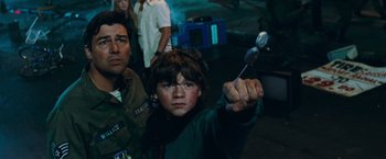 Movie still from “Super 8” (2011), directed by J.J. Abrams – A young boy holding a spoon in his right hand; Medium shot, Over the shoulder angle