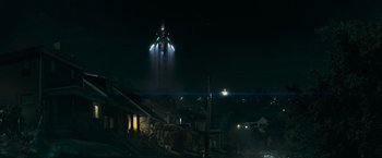 Movie still from “Super 8” (2011), directed by J.J. Abrams – An image of an airplane that is flying in the sky at night; Extreme Wide shot, Low angle